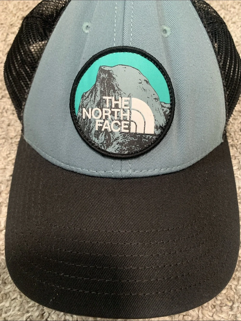 The North Face Mountain Graphic Blue Black Mesh Back Trucker Hat